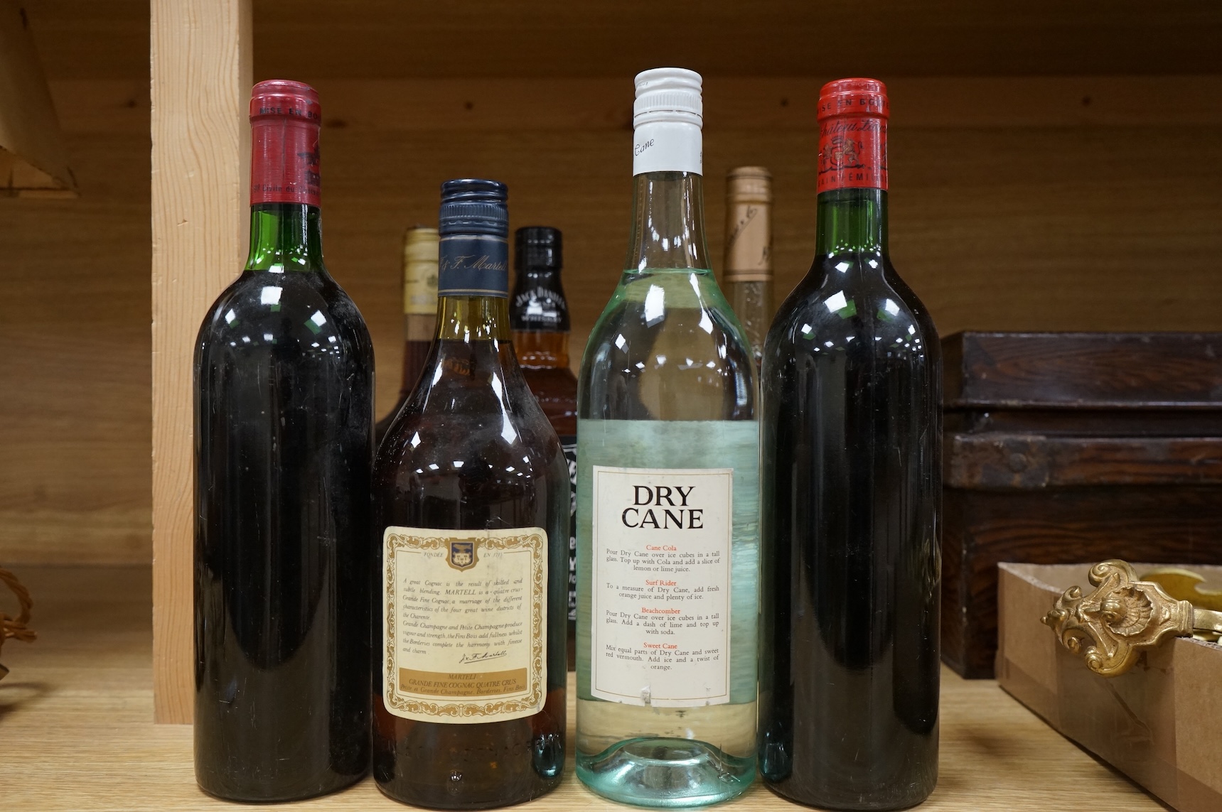 Two bottles of claret and five bottles of spirits to include Dry Cane Rum and Martel Cognac